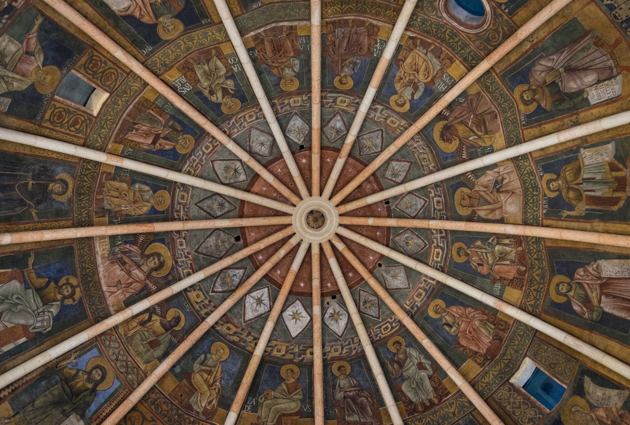 Parma's Baptistery ceiling -- planks leading to the center like a starburst, each segment covered in intricate frescoes.