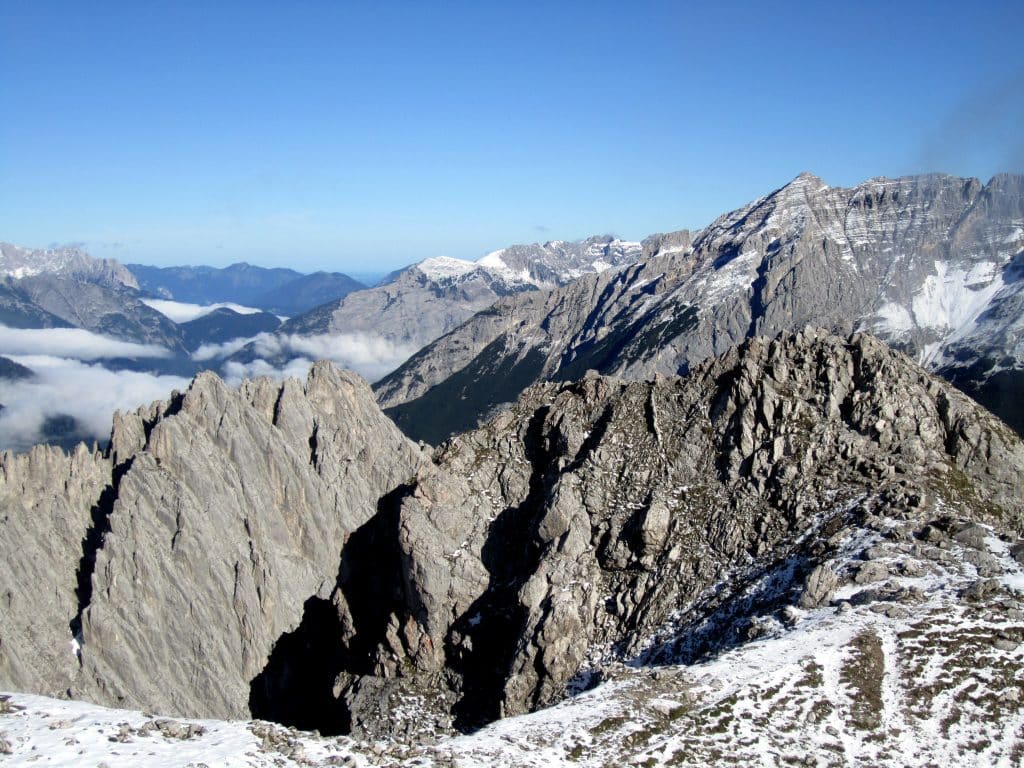 Craggy gray mountains surrounded by snow