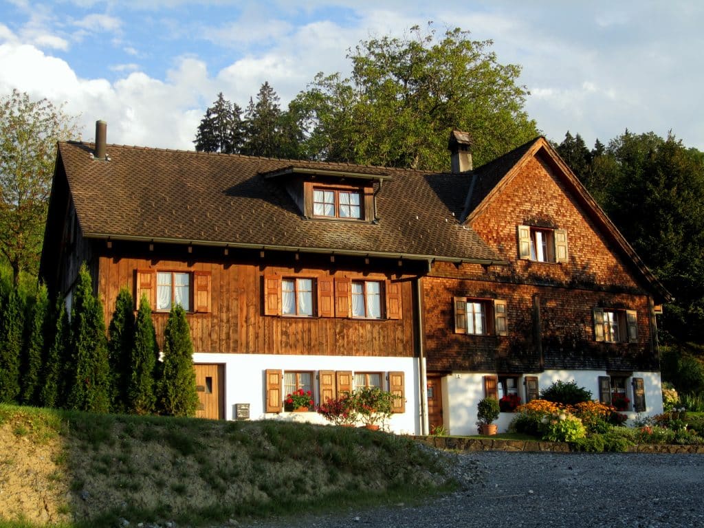 A wooden house with wooden shutters