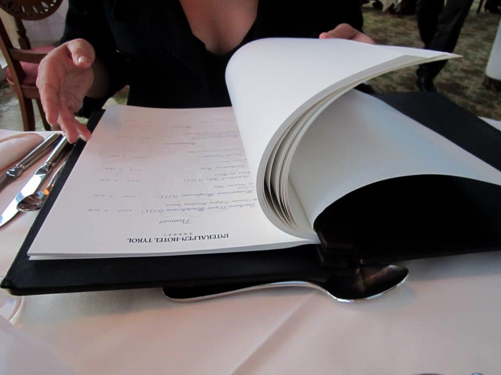 A huge wine list that looks like an encyclopedia volume.