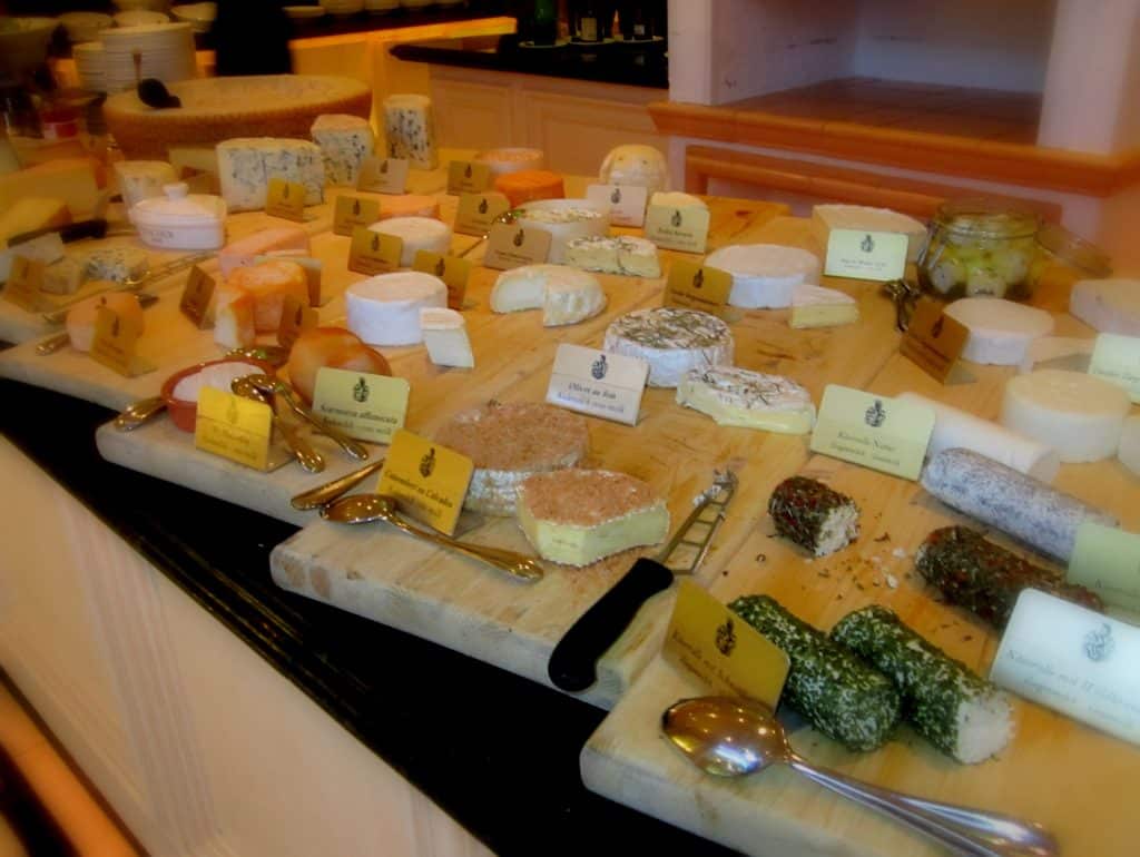 A huge cheese selection at a buffet.