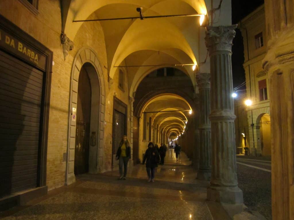 An evening shot of the high arched porticoes in Bologna