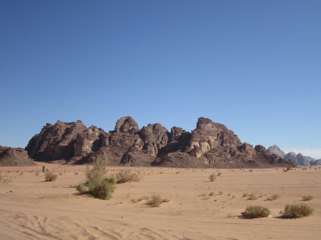 A rocky formation in the middle of the desert.