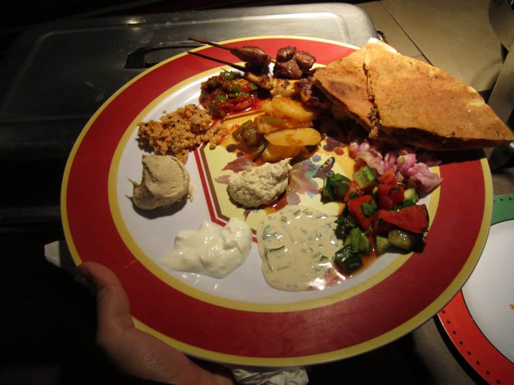 Big plate of humus, pita, and other Middle Eastern food in Jordan