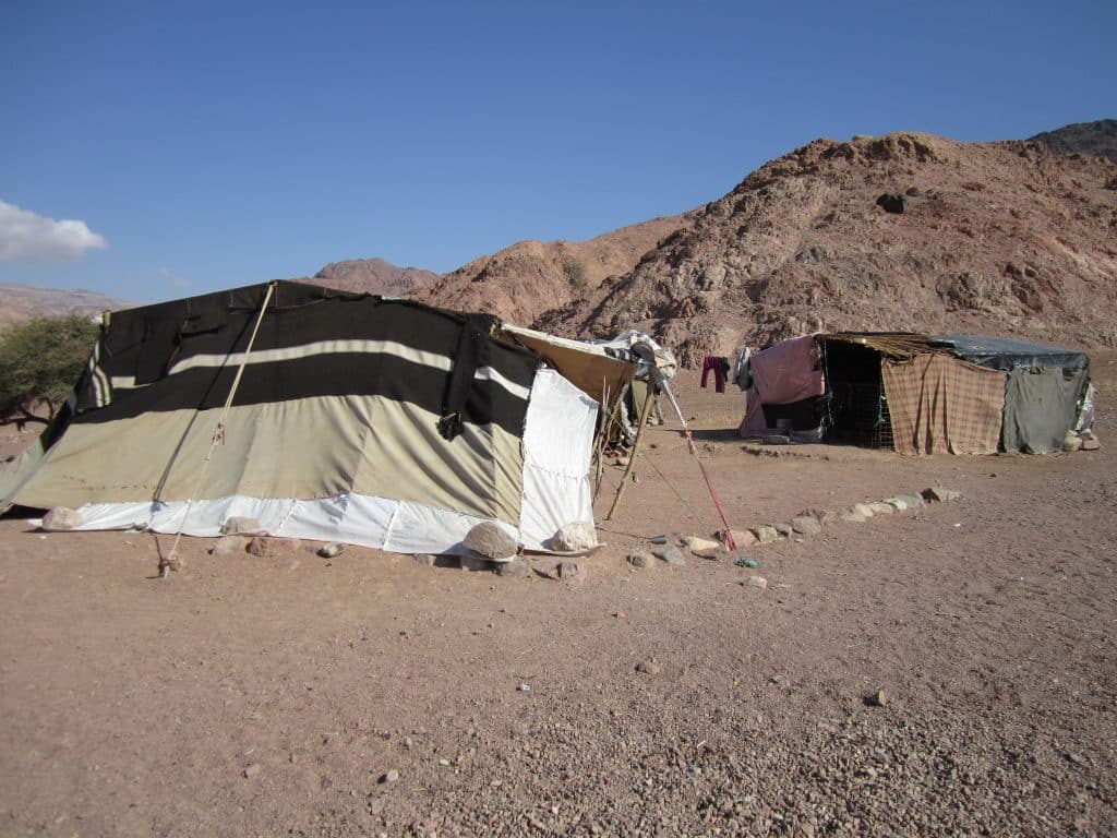 A bedouin tent perched in the desert.