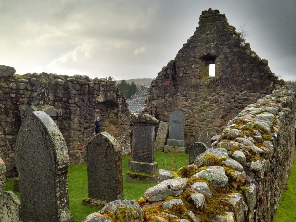 A big empty stone building with its roof missing in Scotland