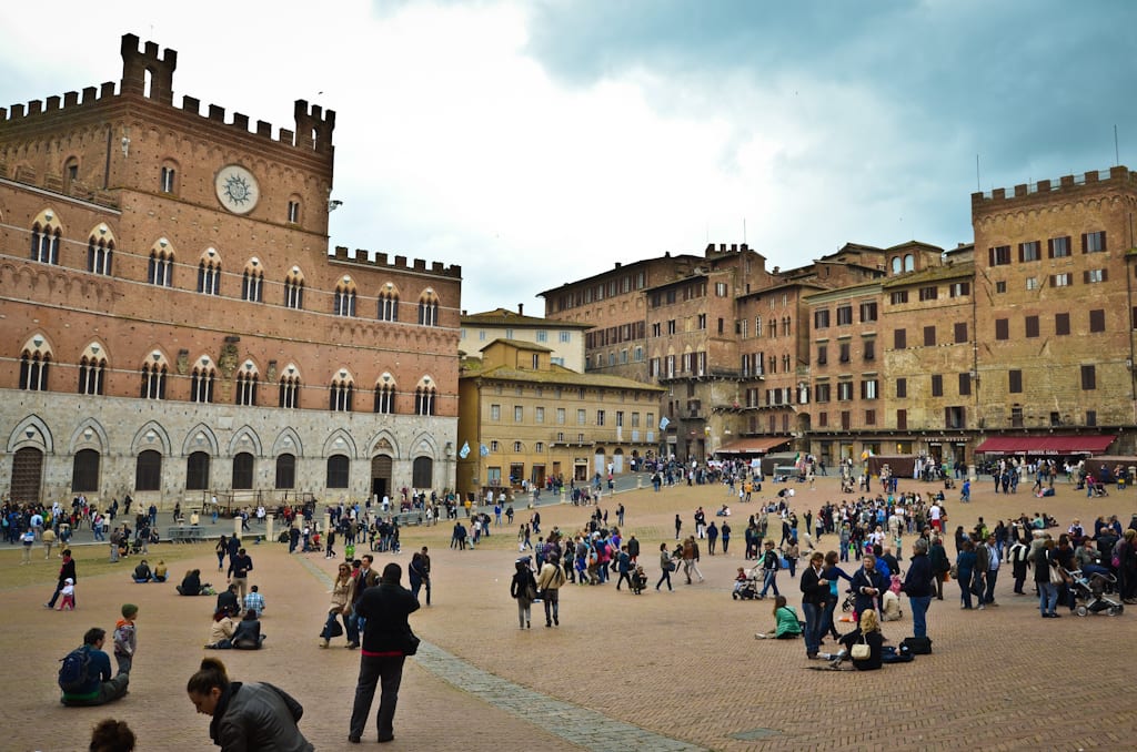 People gathered in the square of Siena Italy