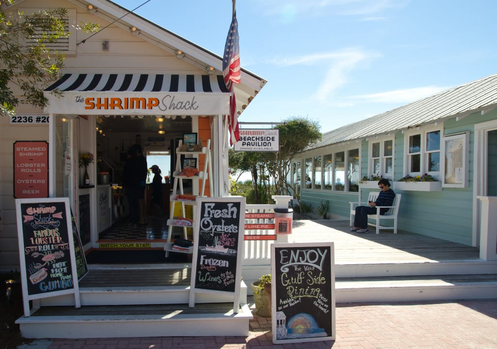 A restaurant called The Shrimp Shack with chalkboard signs advertising oysters and lobster rolls.