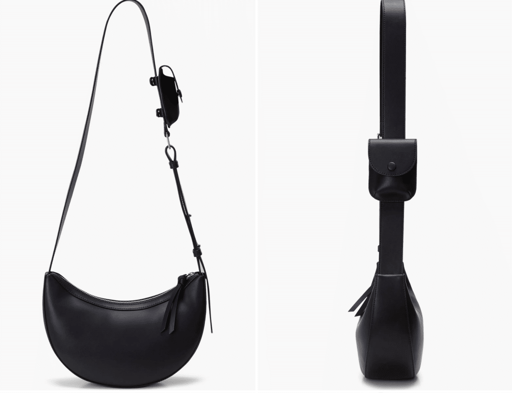 A crescent-shaped black leather bag with a long crossbody strap and a tiny pocket on the strap.