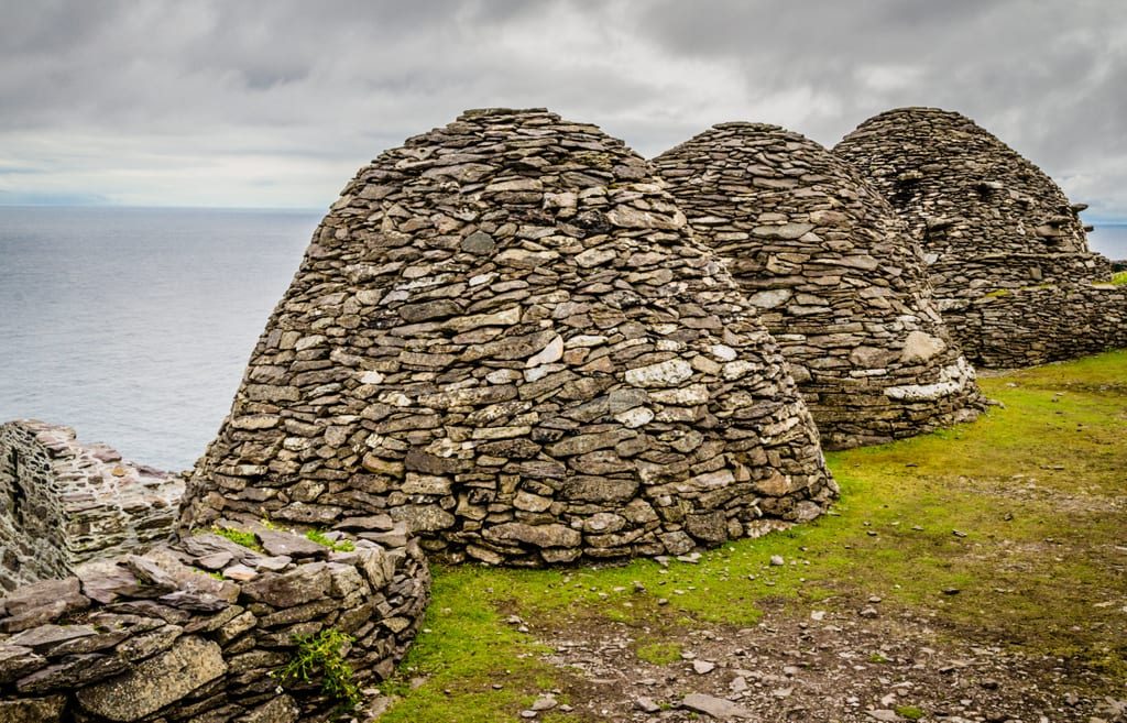 Rocky beehive-shaped huts, all made of rocks perfectly slid together with no mortar holding them together.