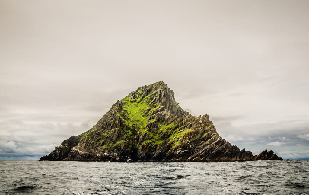 Skellig Michael, the jagged gray-green island, pointing out of the sea.