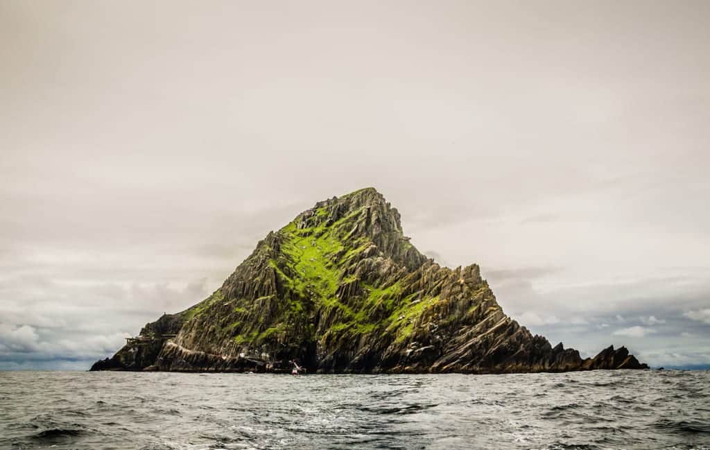 Skellig Michael, the jagged gray-green island, pointing out of the sea.