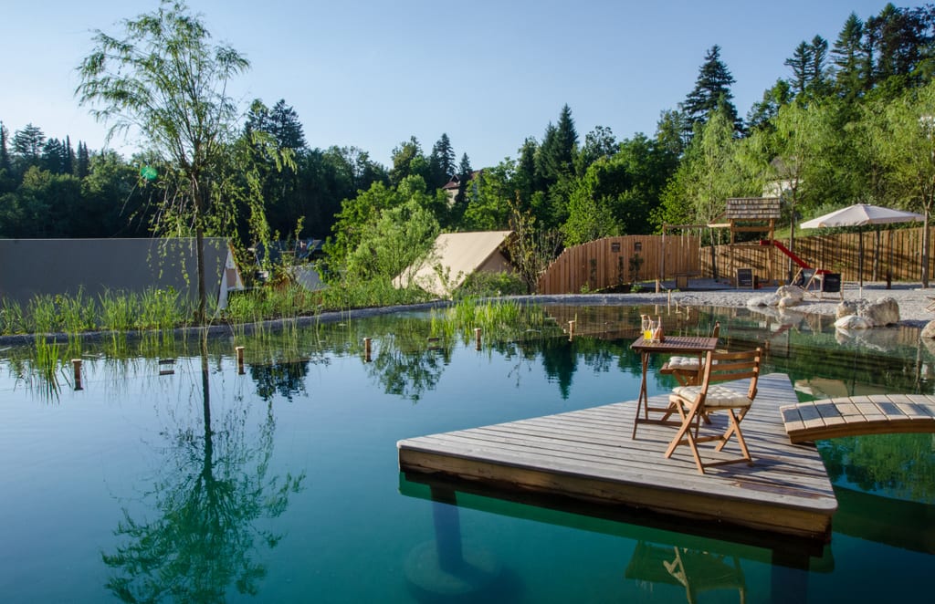 A natural turquoise pool at Garden Village in Bled, Slovenia