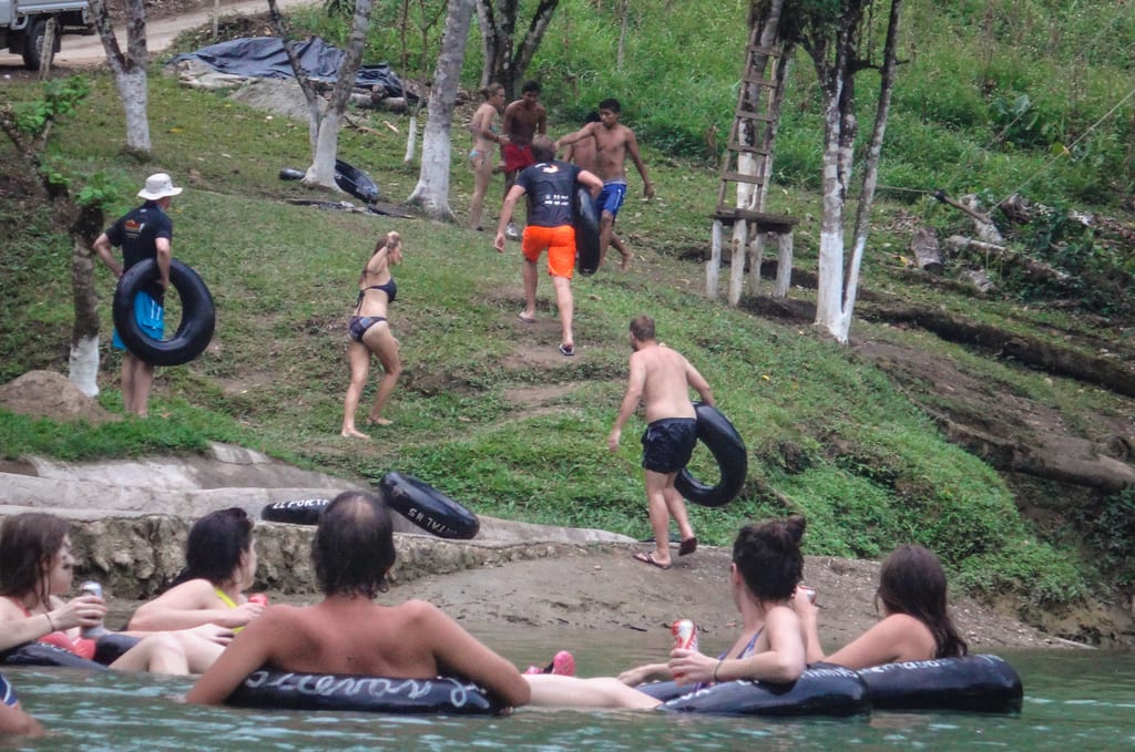 People in inner tubes floating down the river at Semuc Champey.