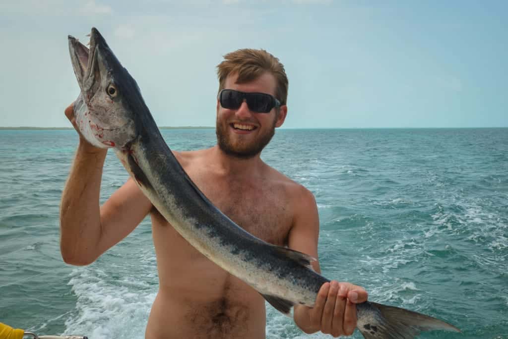 Paul catches a fish in Belize