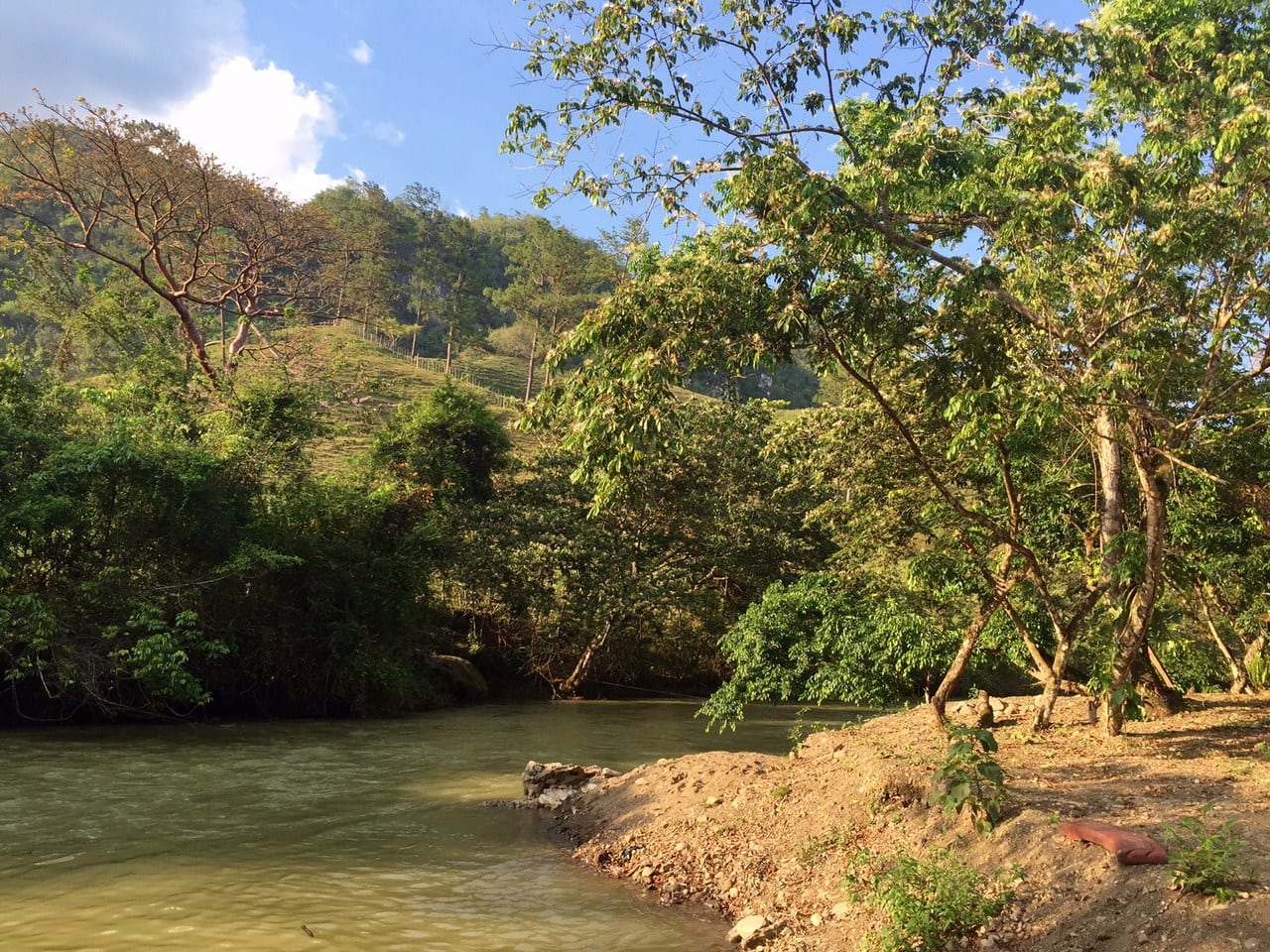 The calm river and bank near El Retiro Lodge in Guatemala