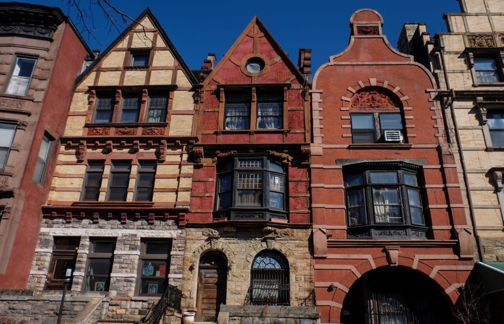 A row of brownstones in random different designs.