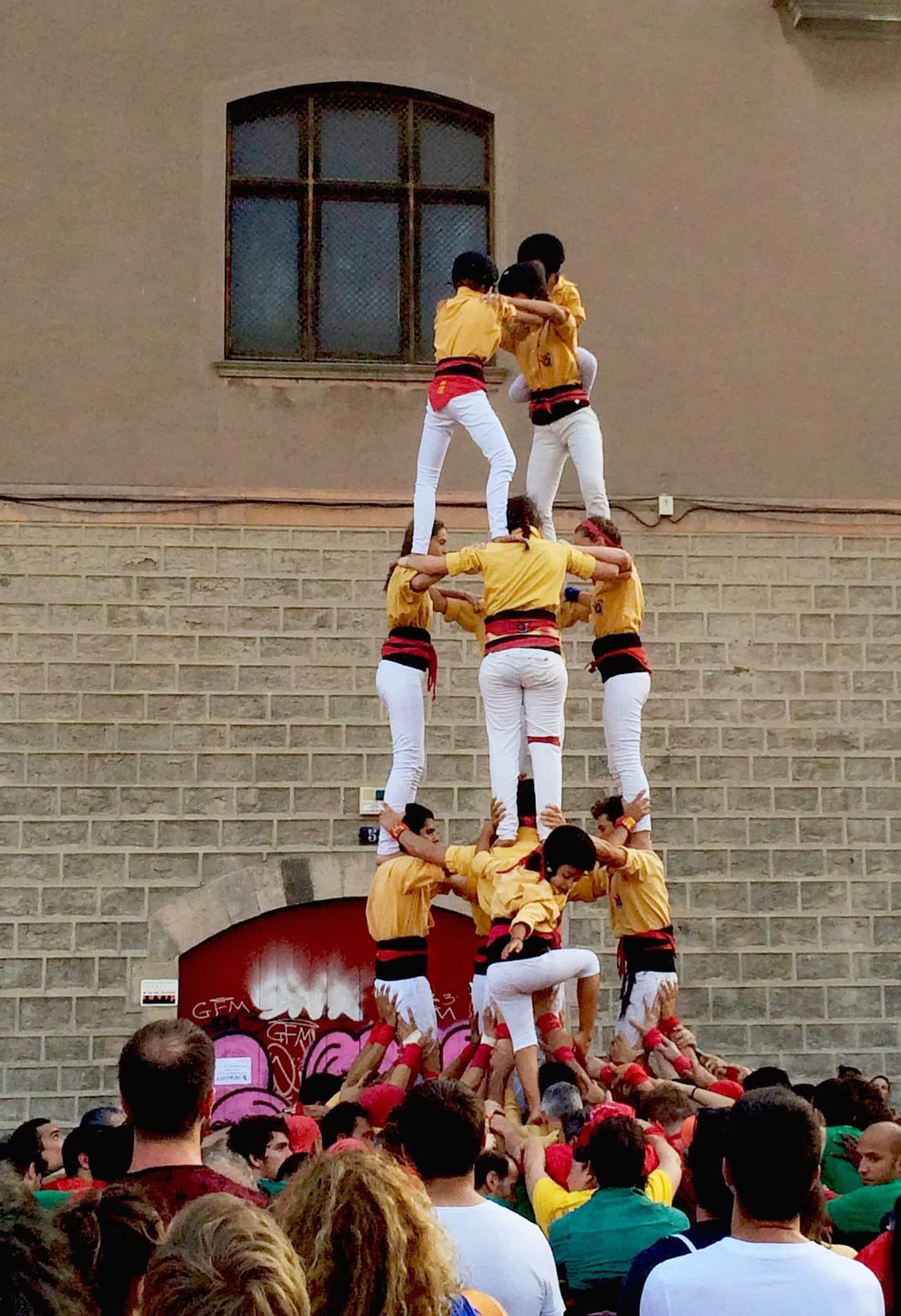 A human tower of kids on a Barcelona street. 