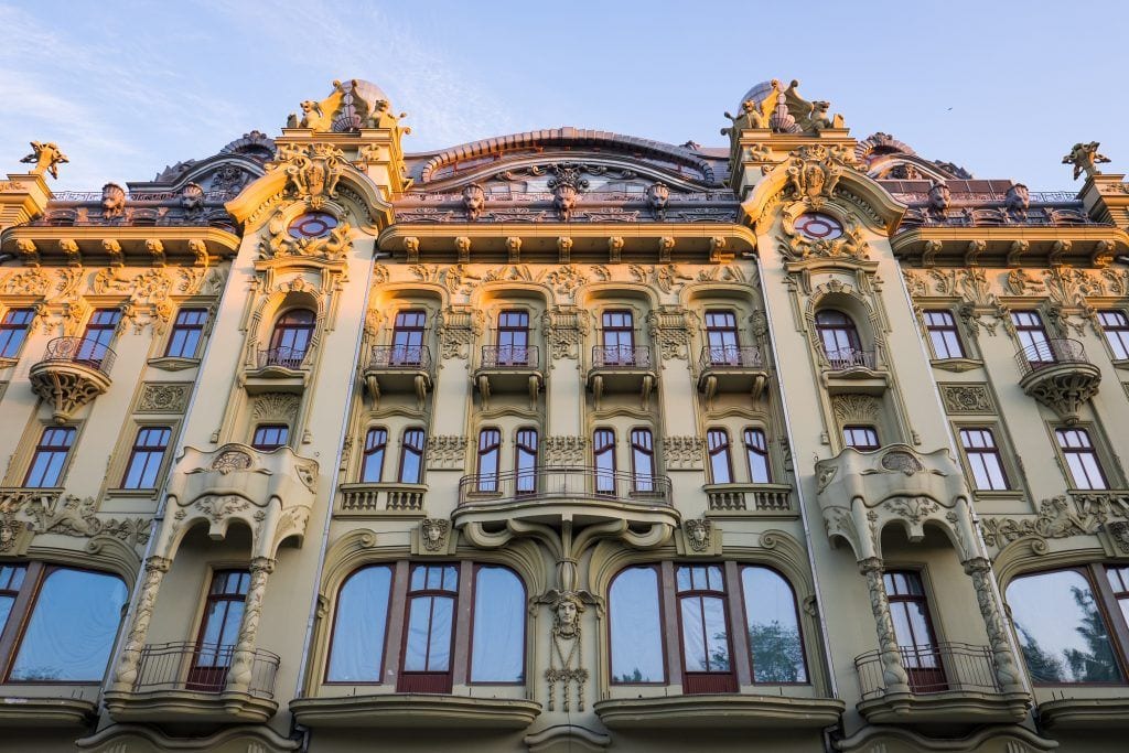 A crenellated building in Odessa just before sunset, golden light touching the top of the building.