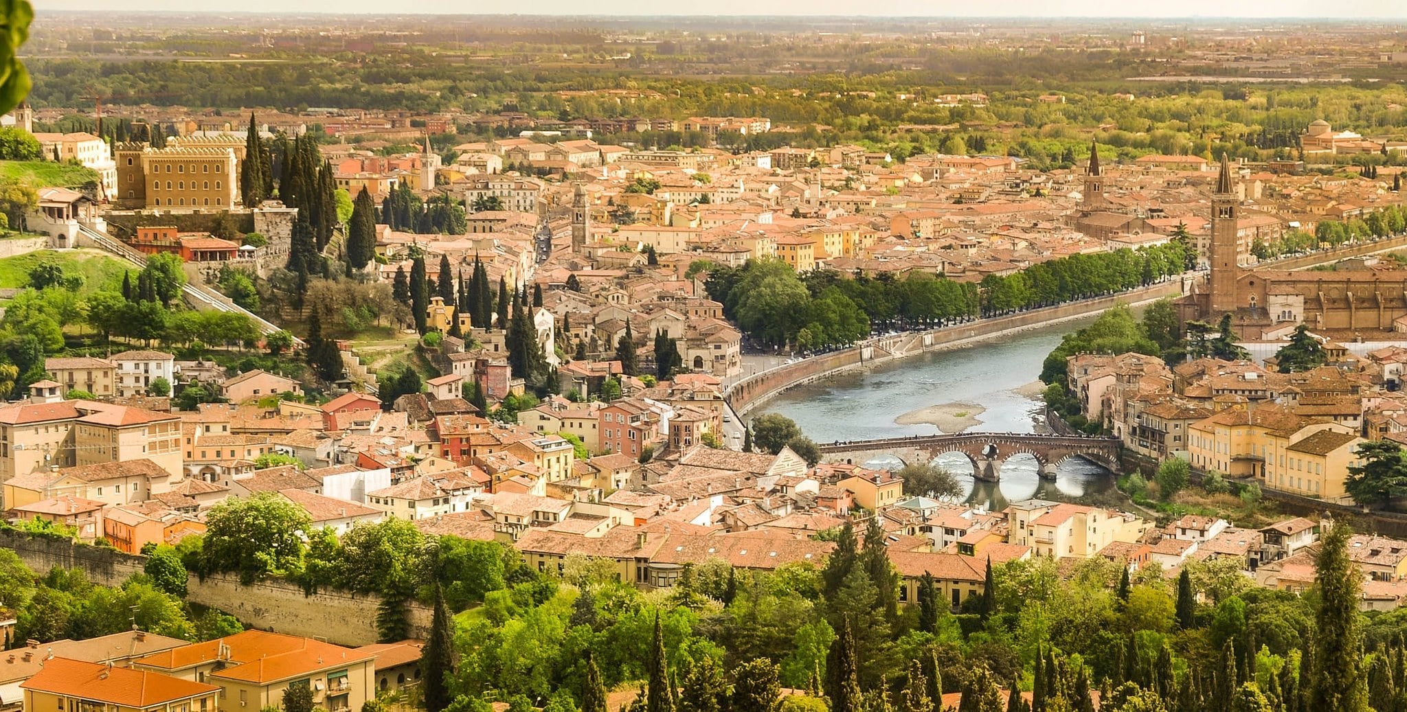 Aerial view of Verona Italy, showing the buildings, canal, and bridge