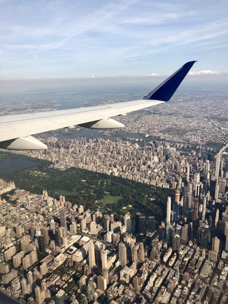 The view from an airplane, flying over Manhattan with views of skyscrapers and Central Park!