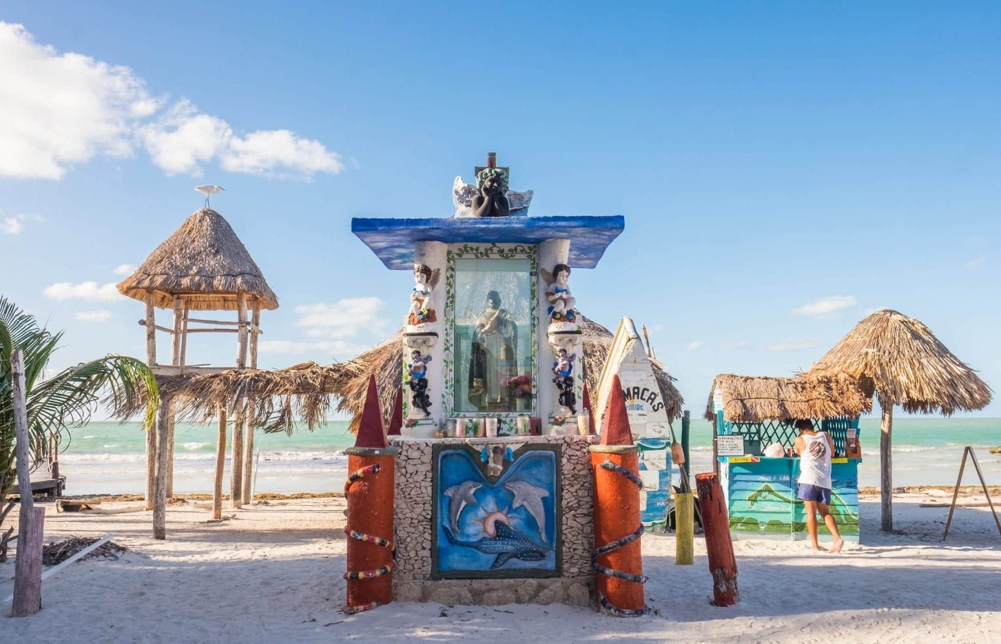 Colorful huts on beach.