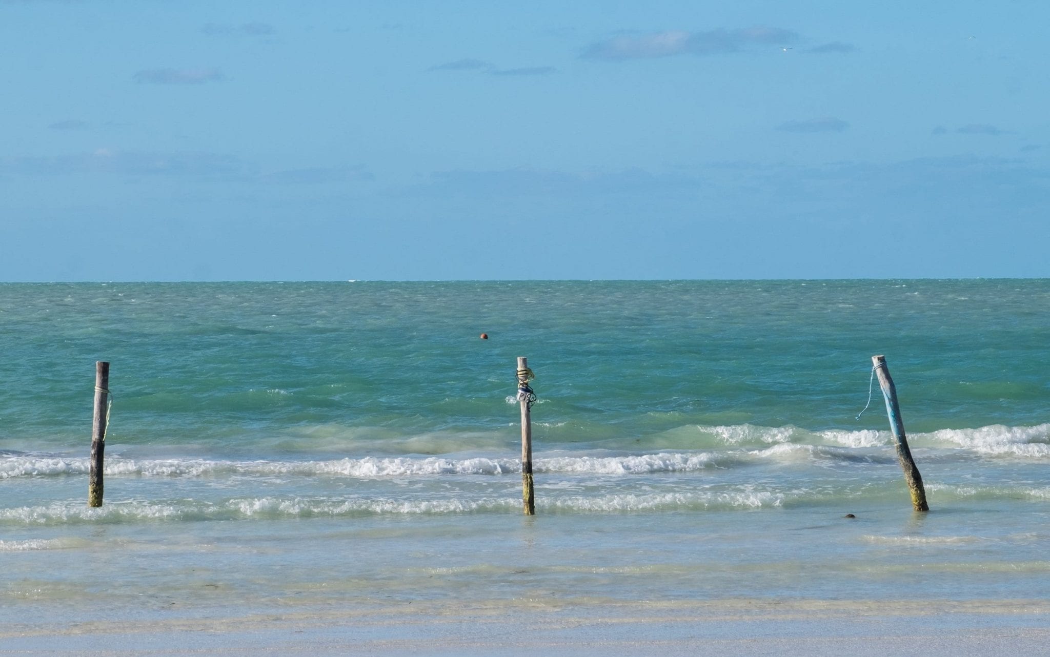 View of turquoise water, looking out into the ocean.