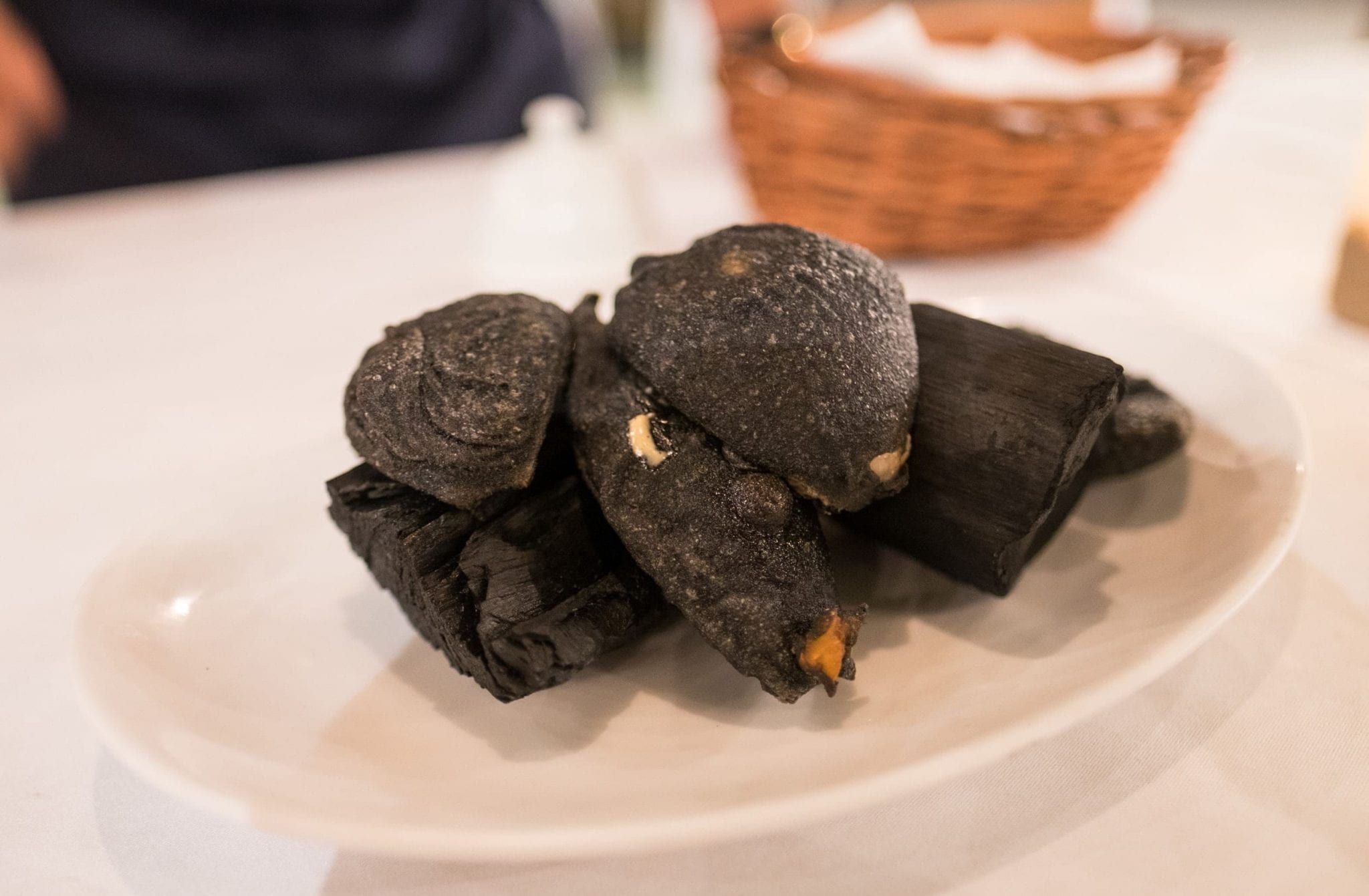 Pickled onions fried in black tempura.