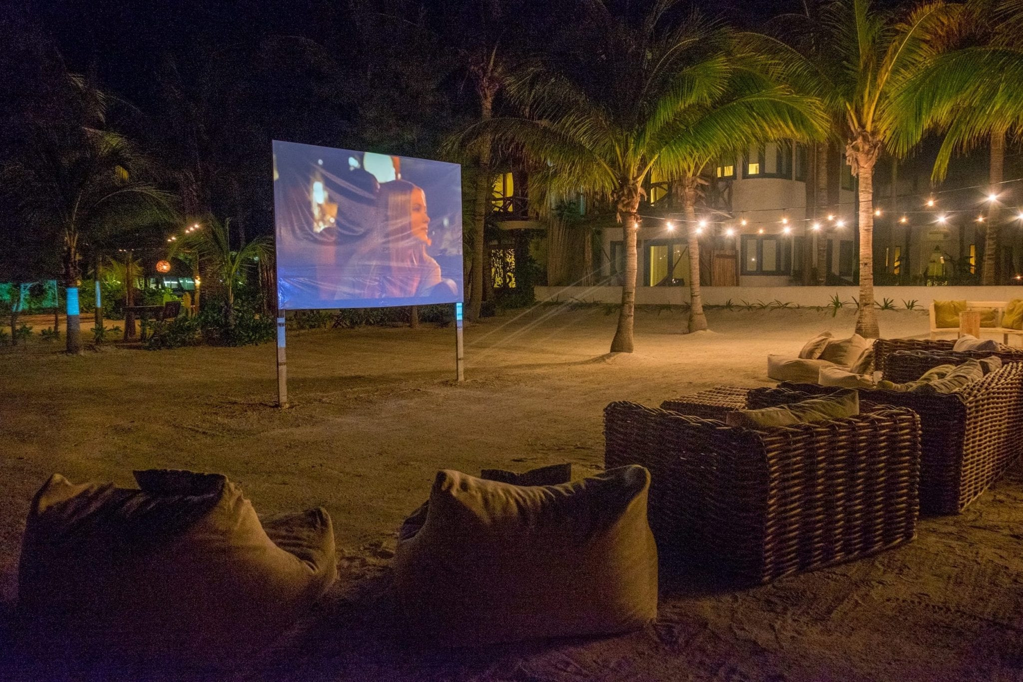 Outdoor movie screening on the beach.