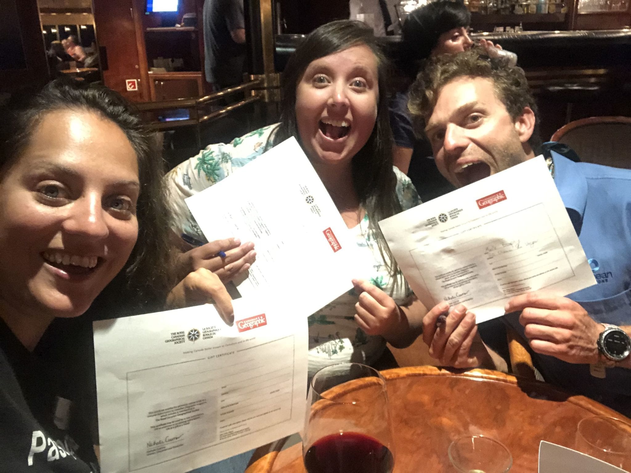 Kate, Brophy, and Cailin hold their certificates for winning the trivia competition, and their free subscriptions to Canadian Geographic magazine.