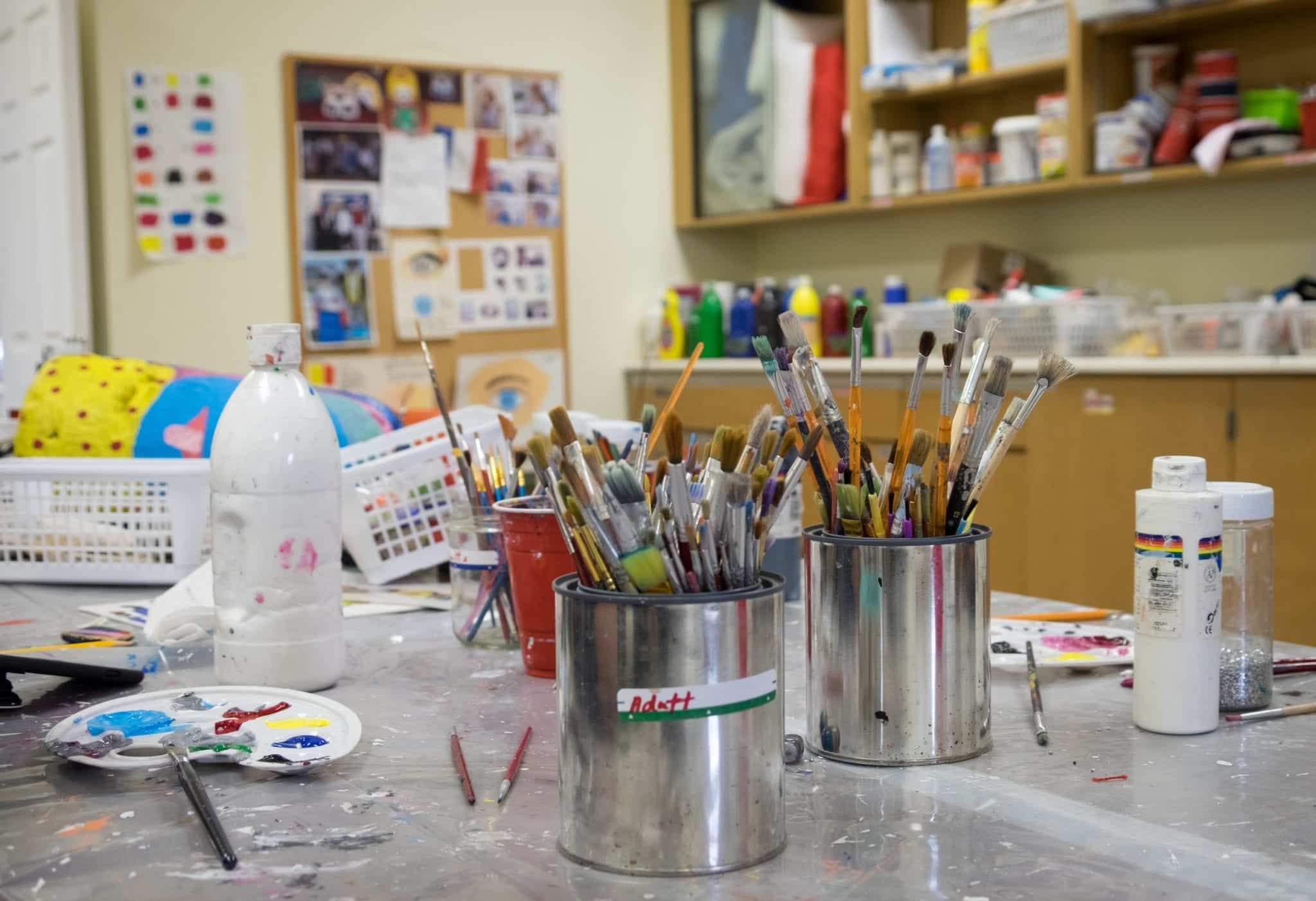 Paintbrushes on a table at the Mi-Careme Centre.