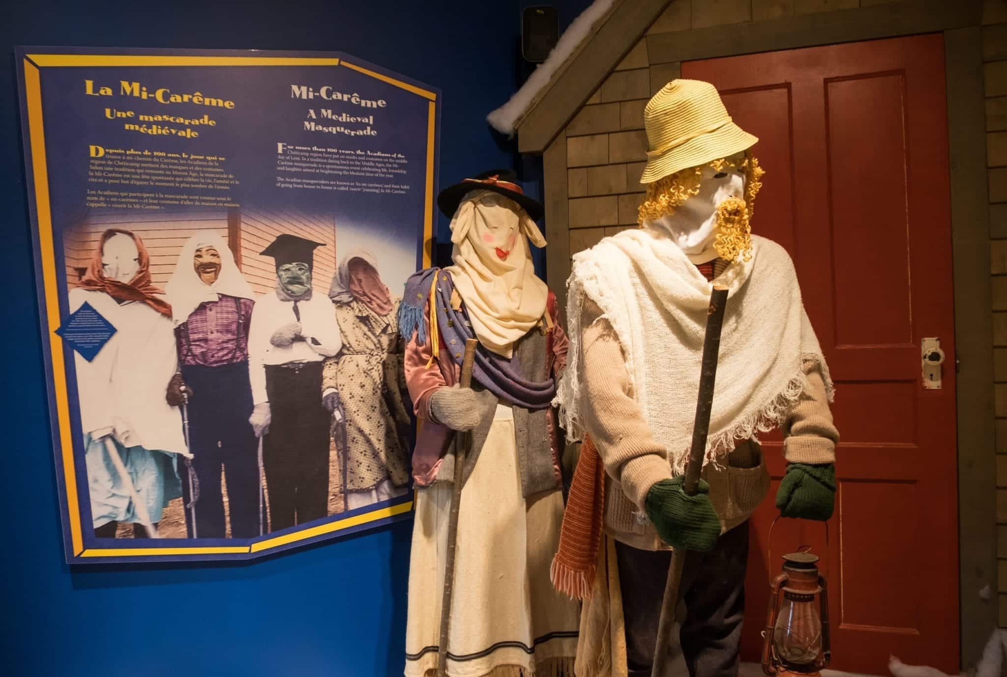Costumed mannequins in full identify-concealing masks and hats at the Mi-Careme Centre