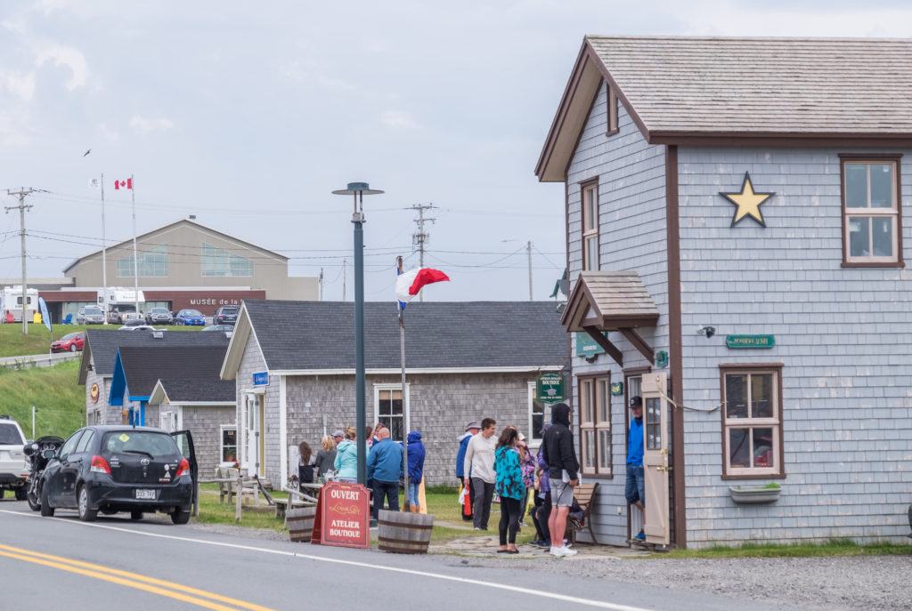 Gray houses and boutiques lined up in rows in the Iles-de-la-Madeleine.