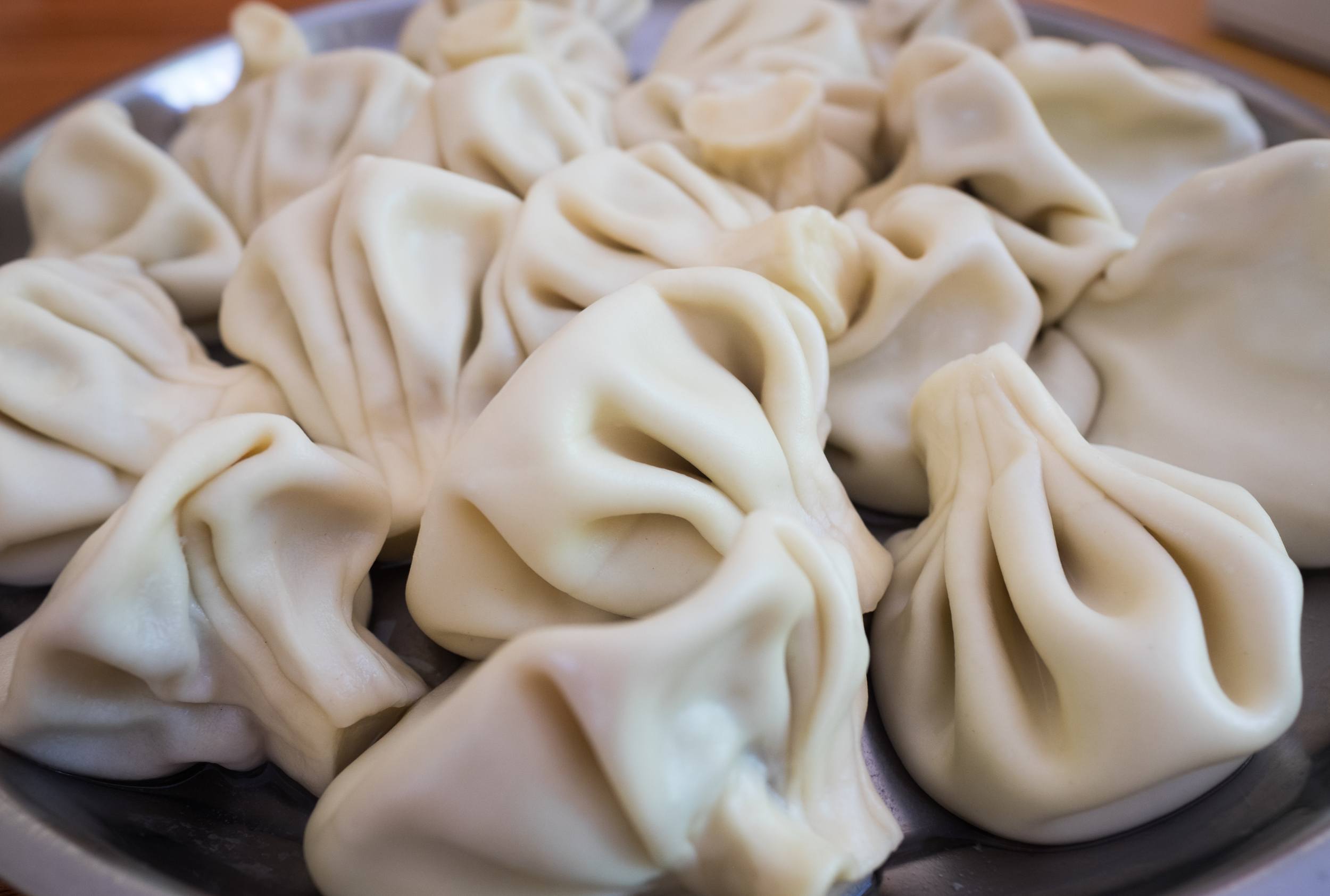 A plate piled with large khinkali, or Georgian dumplings.