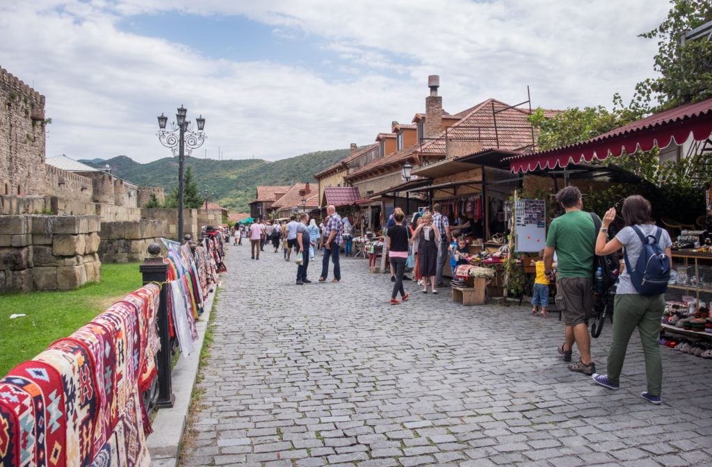 Small kiosks along a cobblestone path in Mtskheta, Georgia.