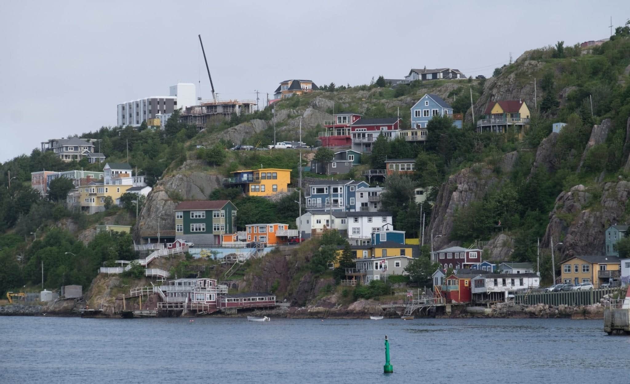 A shot of cottages on the harbor, but faded and dark.