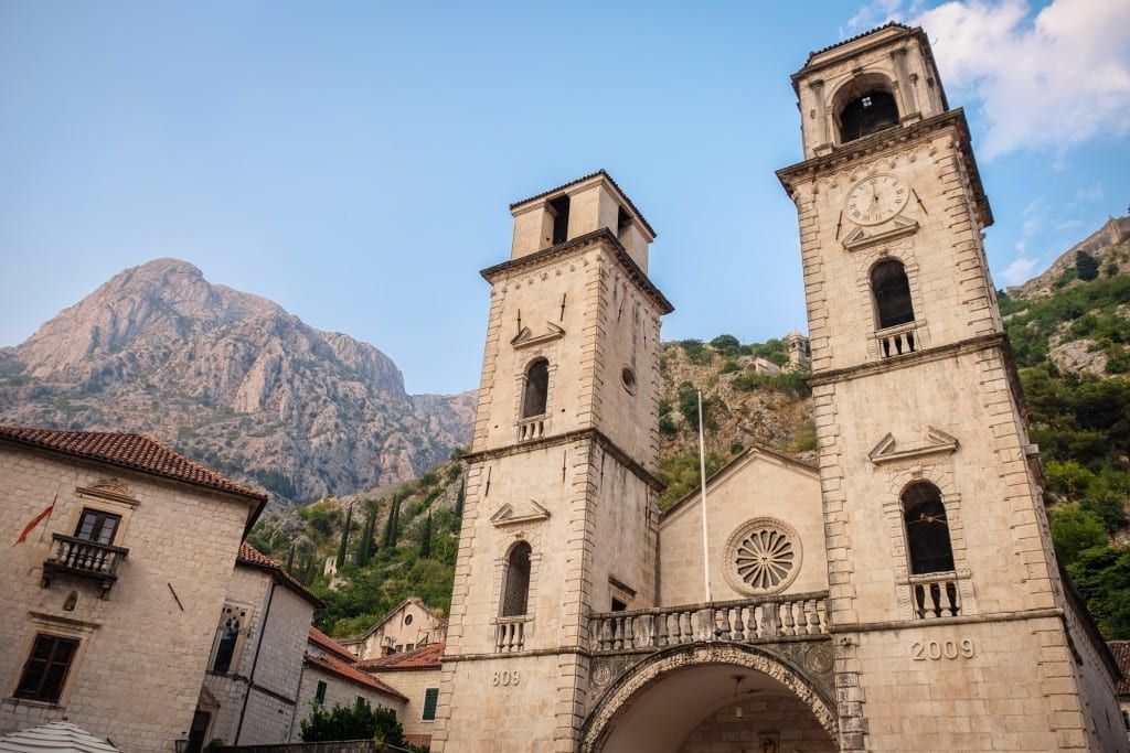 A church in Kotor set against the mountains.