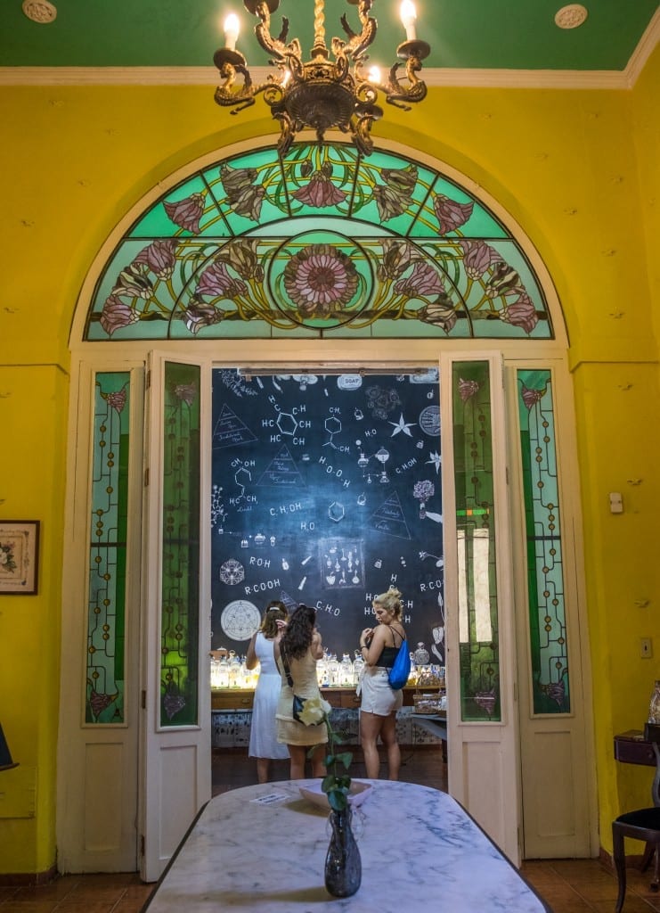 Green and purple stained glass windows in the Museum of Perfume, Havana