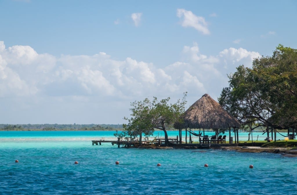 A lake that changes several different shades of blue as you go further out.