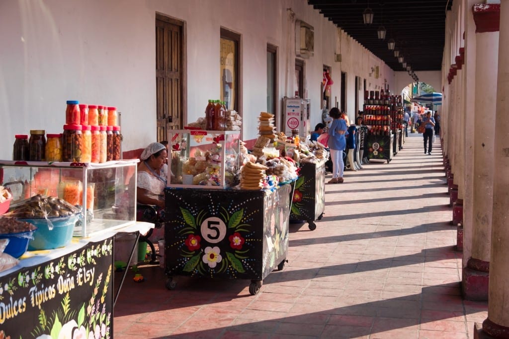 Street vendors lined up, selling baked goods on the streets of Chiapa de Corzo.