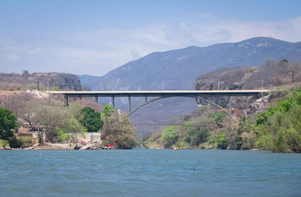 A metal bridge connecting two canyon sides.