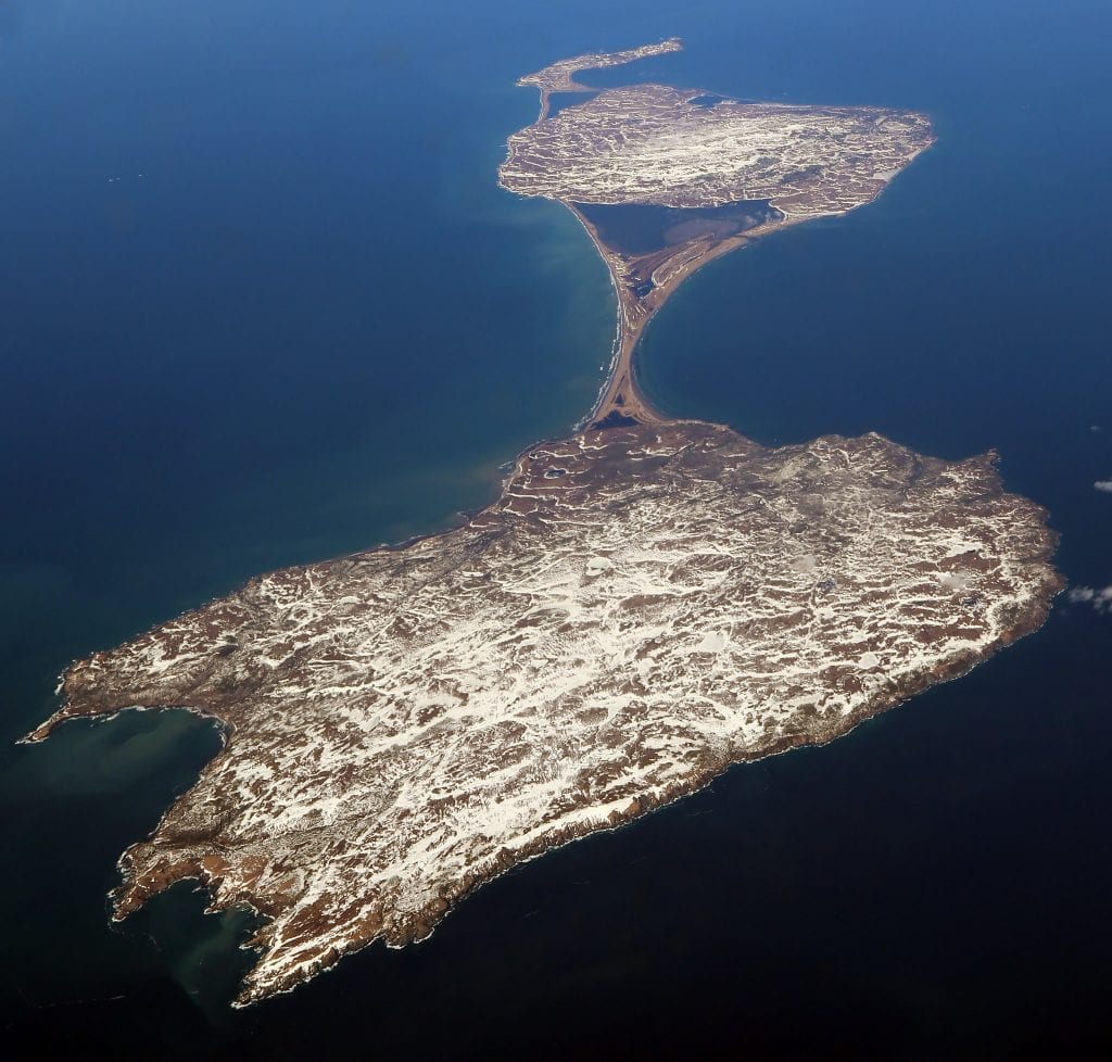 Miquelon Island as viewed from the air, shaped liked an hourglass in the ocean.