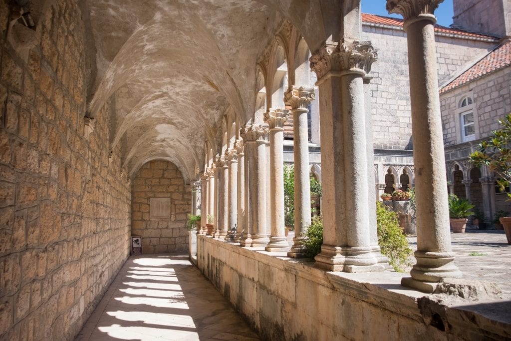 Scene from Badija's monastery -- rows of columns edging a stone courtyard.