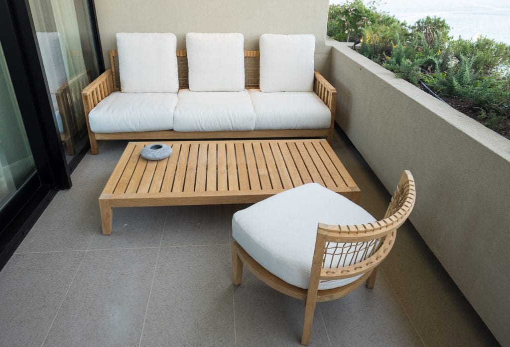 Balcony with a couch, chair and patio table at Hotel Dubrovnik Palace