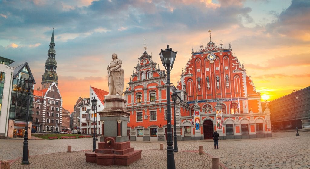 Triangular, pointy, crenellated, orangey-red buildings in Riga.