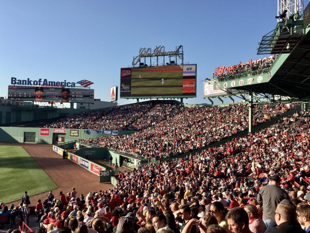 Fenway Park baseball stadium: thousands of people in the stands, many of them wearing red.