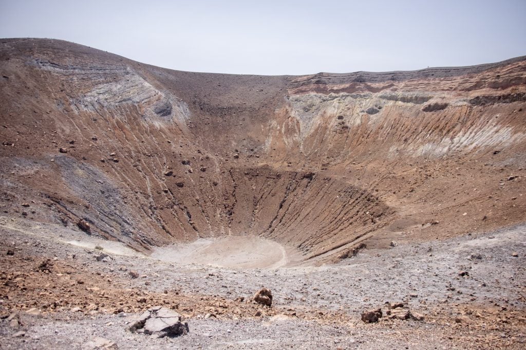 The bright gray-red crater, looking almost liquid in the center.