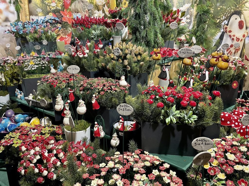 Piles of garden ornaments you stick into your plants, covered with mushrooms, ladybugs, and flowers.