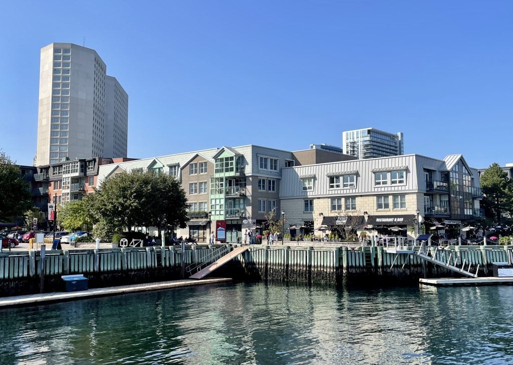 Several modern buildings on the Halifax waterfront, including outdoor cafes.