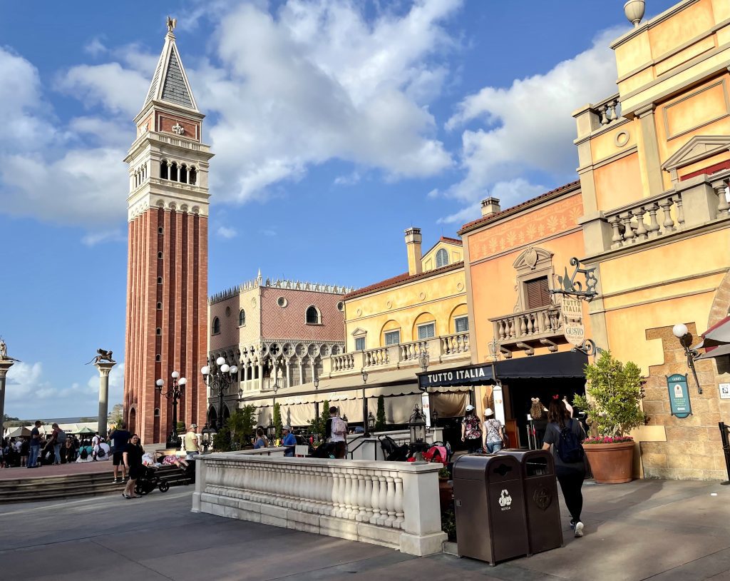The Italy pavilion, with a replica of Venice's bell tower, all pink brick with a gray pointy top.